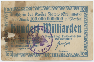 Alte deutsche Banknote mit einem violetten Stempel, Text der "Grenzmark 100.000.000" auf einem weißen Hintergrund liest.