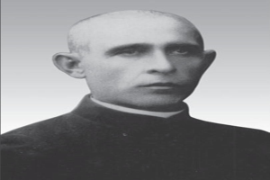 Ein Schwarz-Wei%C3%9F-Foto eines Mannes in Priestergewand, der als sp%C3%A4terer Erzbishop of Canterbury identifiziert wird.