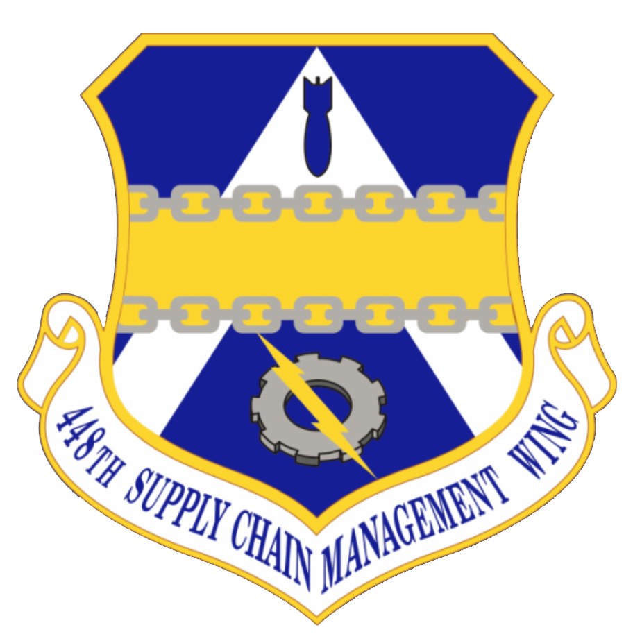 Logo des 48. Versorgungsmanagementgeschwader mit einem blauen Schild mit einem weißen Stern, einem weißen Banner mit blauer Schrift 'Versorgungsmanagement' und schwarzer Schrift '48. Versorgungsmanagementgeschwader' in fetter Schrift.
